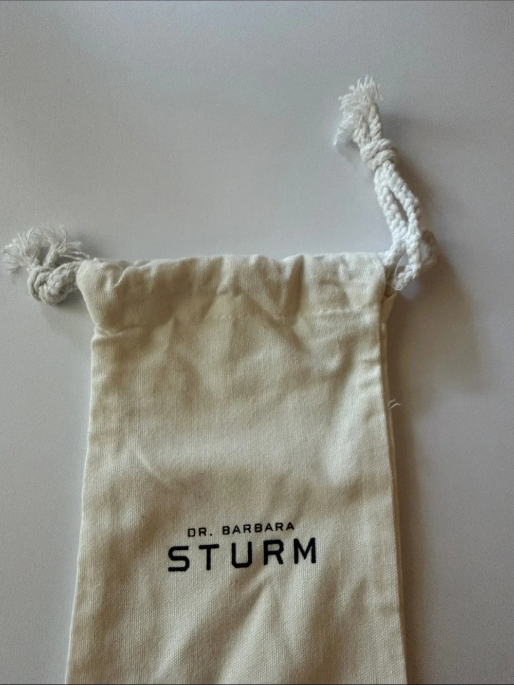 NWOT Dr. Barbara Sturm Cream Canvas Drawstring Bag with Black Logo